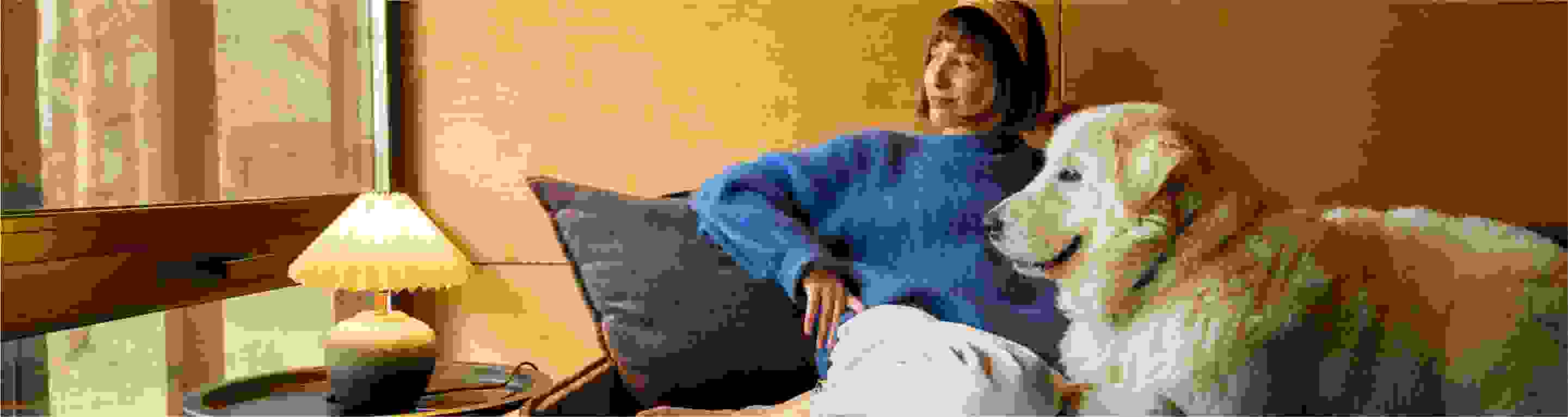 Woman on a sofa with a dog